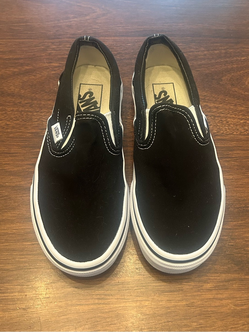 Vans Black & White Slip-On Canvas Sneakers